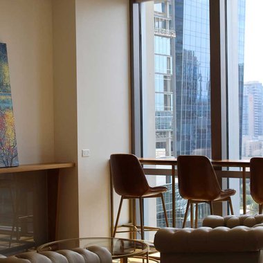 Exquisitely furnished private office with a panoramic display of the city