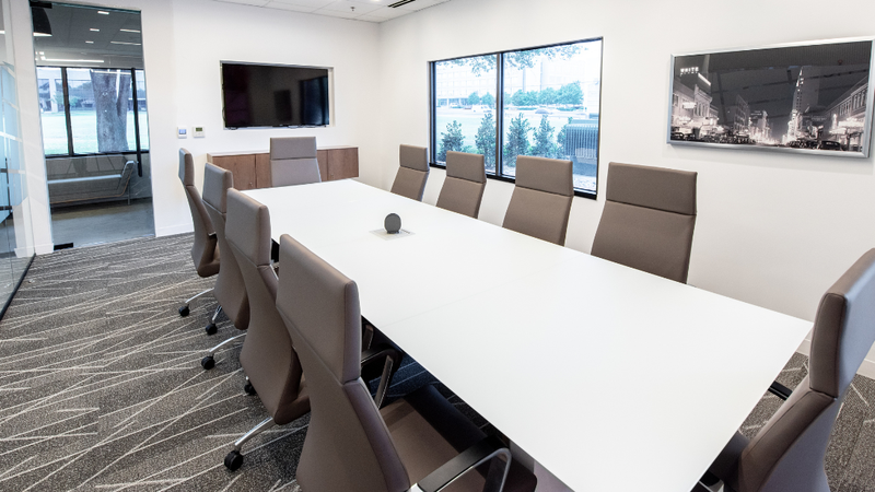 A high-end meeting room at a coworking space in Addison. 