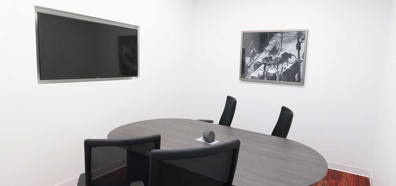 Office meeting room with a widescreen display